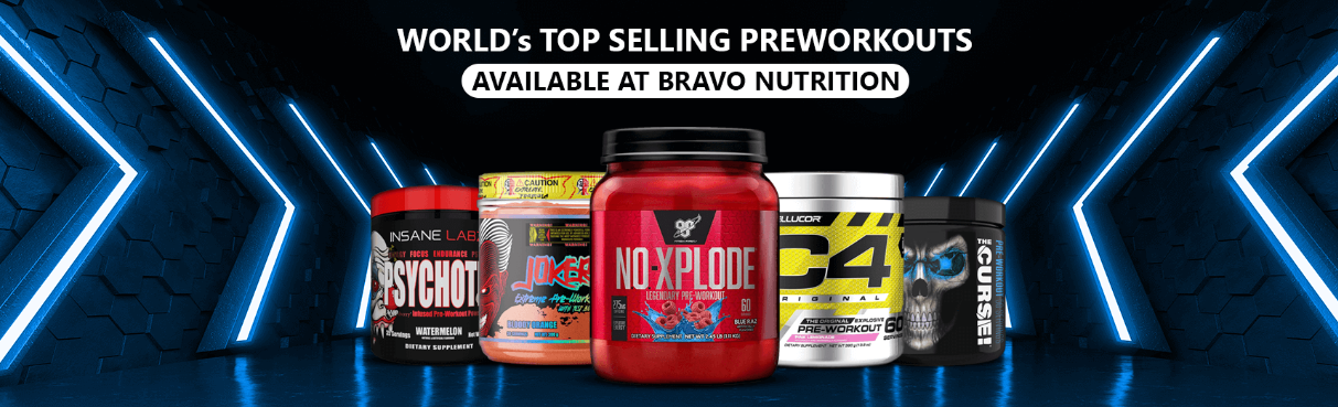 A wide picture of a gym focused on weight rack and in distance a girl doing dumbell rows